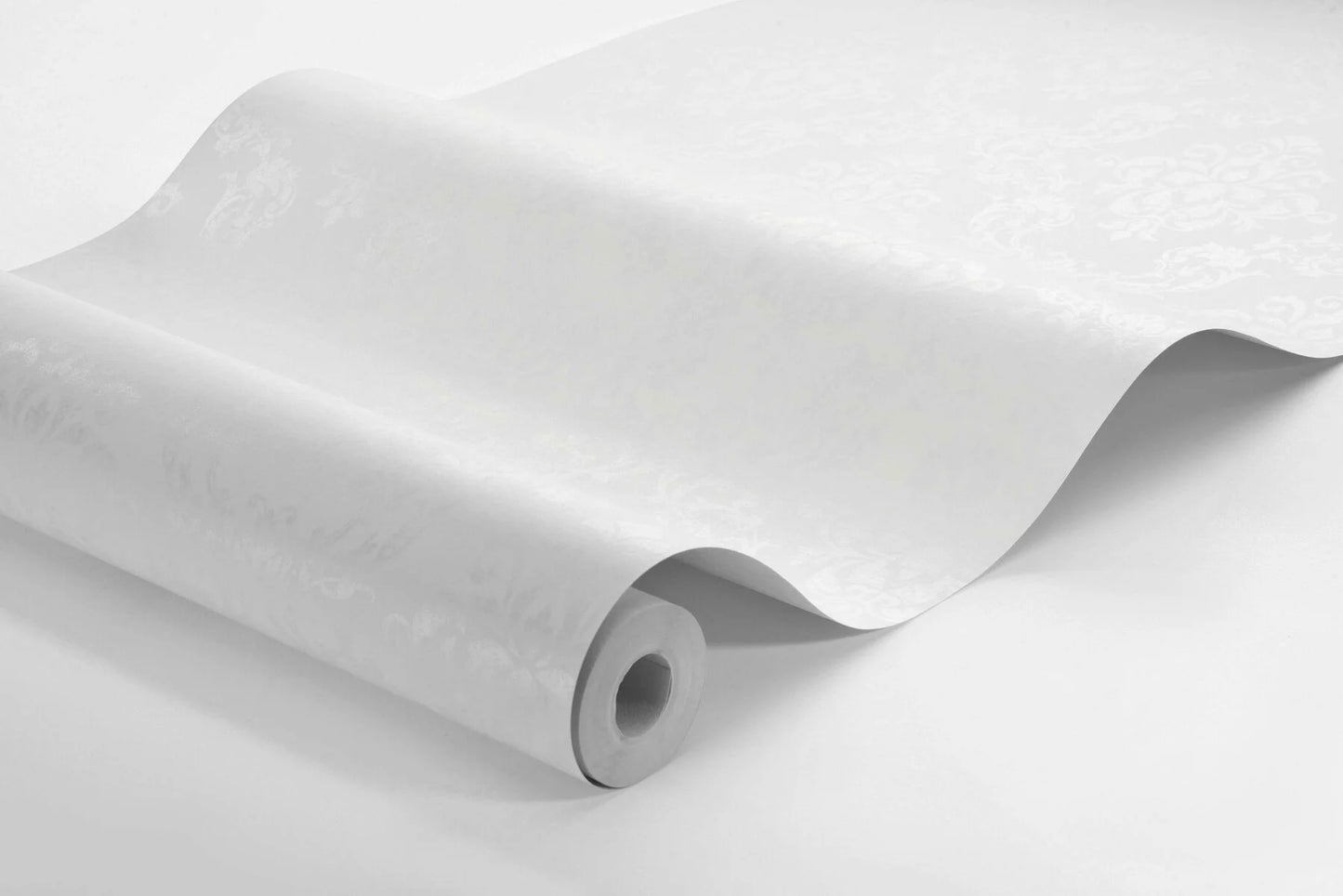 Colored in a neutral palette of white with a dreamy shimmering effect, our Ottilia wallpaper creates a classic, understated yet luxurious look for your interior