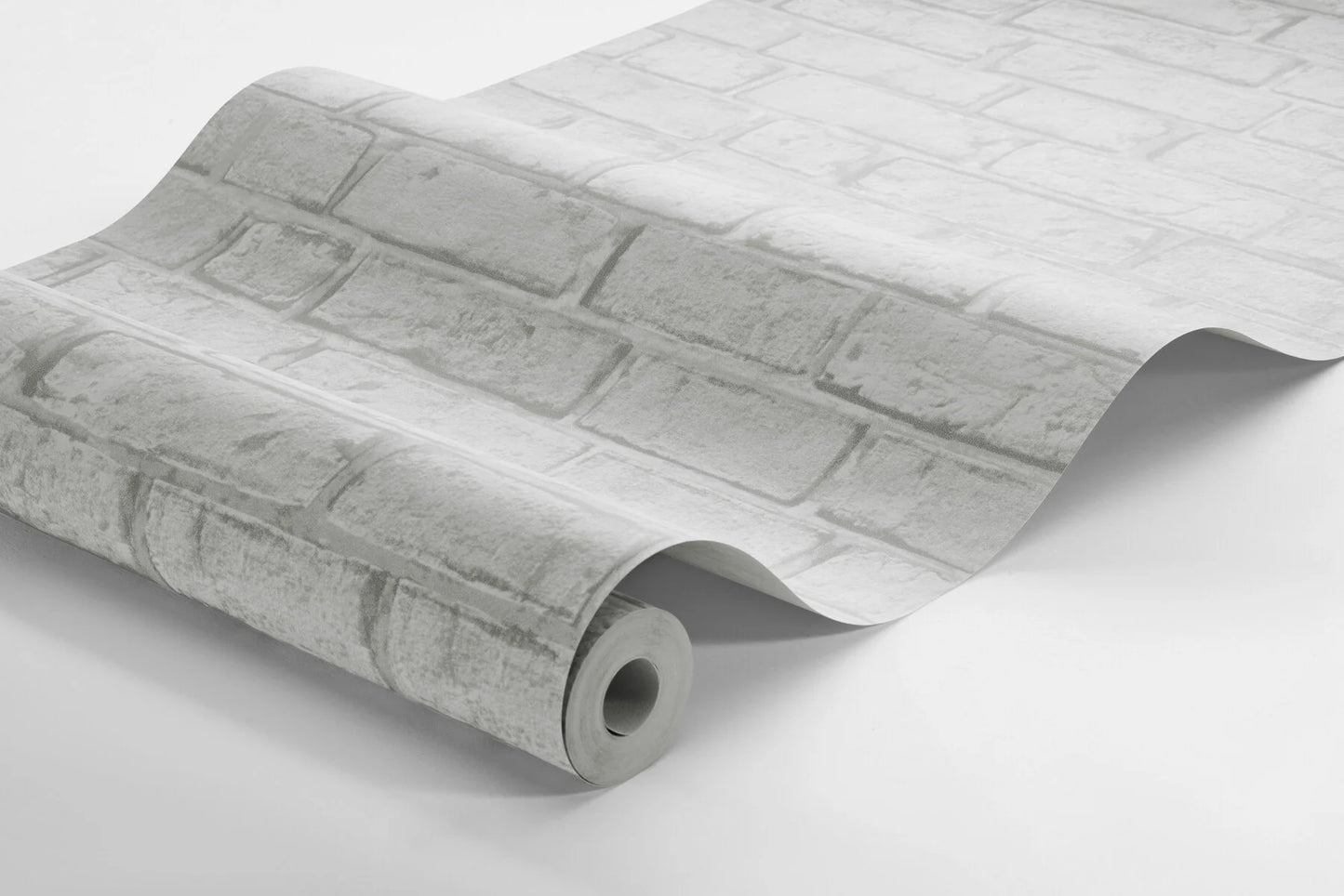 Colored in warm, grey shades, our Birk wallpaper with its cement, lime-like surface breathes a unique and inviting expression into your home.