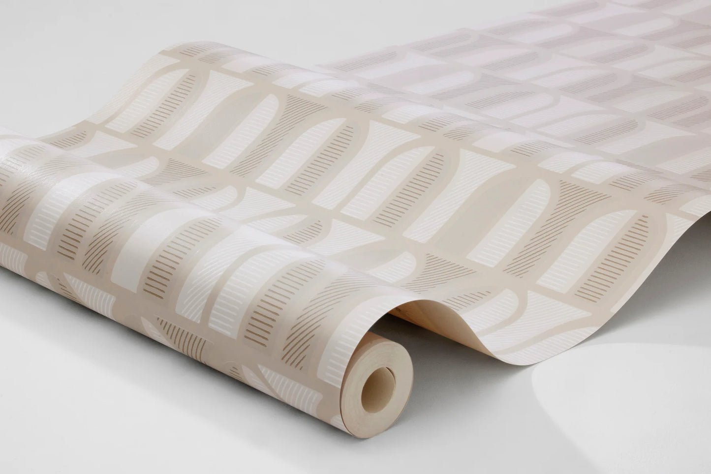 Colored in soft pastel beige tones, our Venice wallpaper draws inspiration from 1970s Italy and the elegant windows of old Venetian buildings.