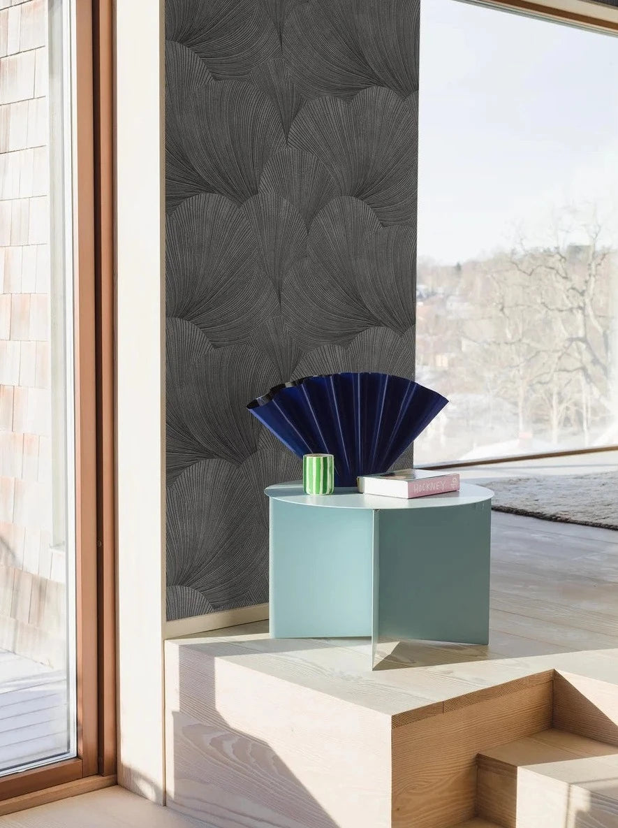 Colored in a dark and granite grey tones with contrasting hints of glittering gold, our Mirage wallpaper features a soft graphic pattern to match its chic and stylish palette.