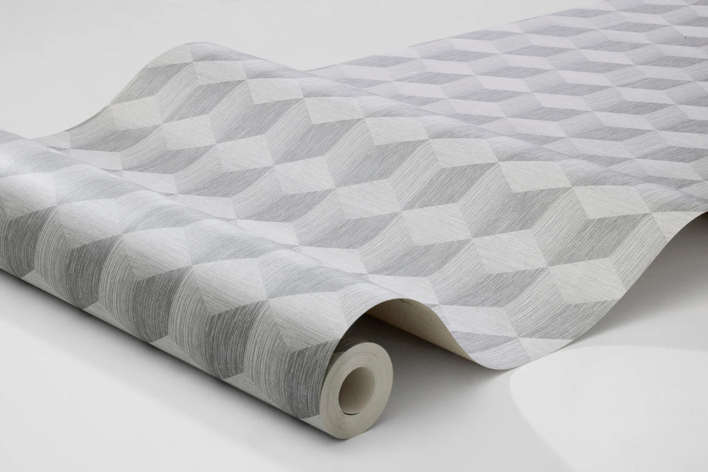 Experience the subtle elegance of our Cube wallpaper colored in neutral and on-trend grey tones.