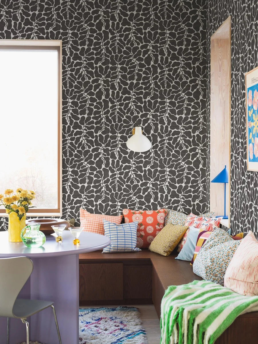 Escape to a tranquil oasis with the foliage pattern of My Secret Garden wallpaper in muted black tones on a crisp white background.