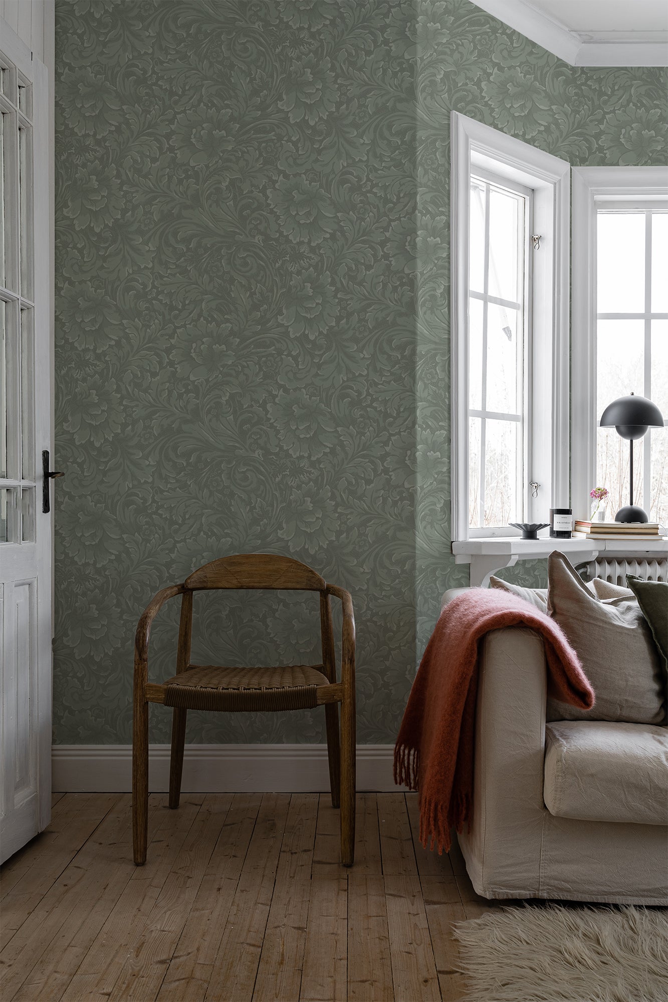 In a blend of fantasy and tradition on wallpaper, leafy tendrils and ornaments intertwine.