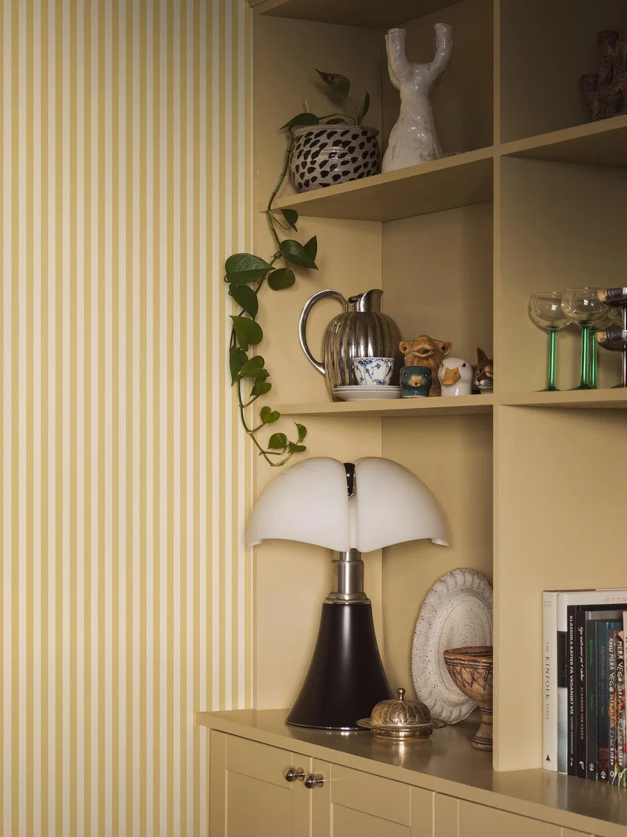 Mölle Stripe is a striped wallpaper inspired by the classic Swedish seaside town of Mölle in Skåne – known for its free-spirited bathing culture at the turn of the 20th century.