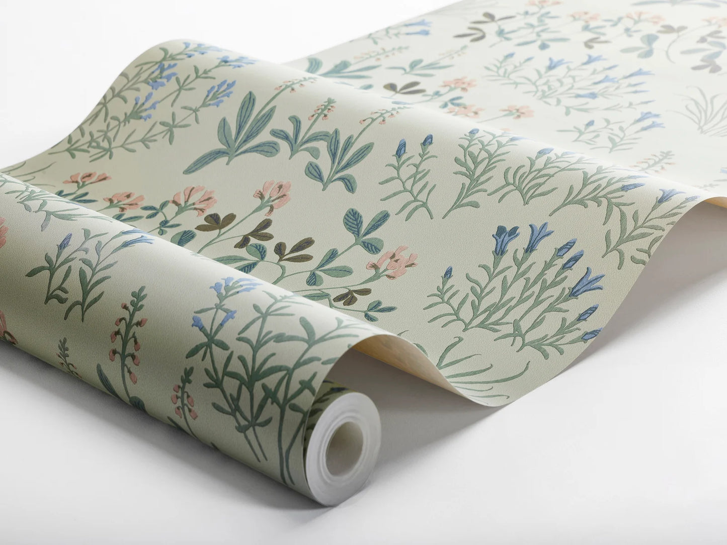 Immerse yourself in the fresh allure of our Noras Äng wallpaper featuring a delicate floral design enhanced by gravure print.