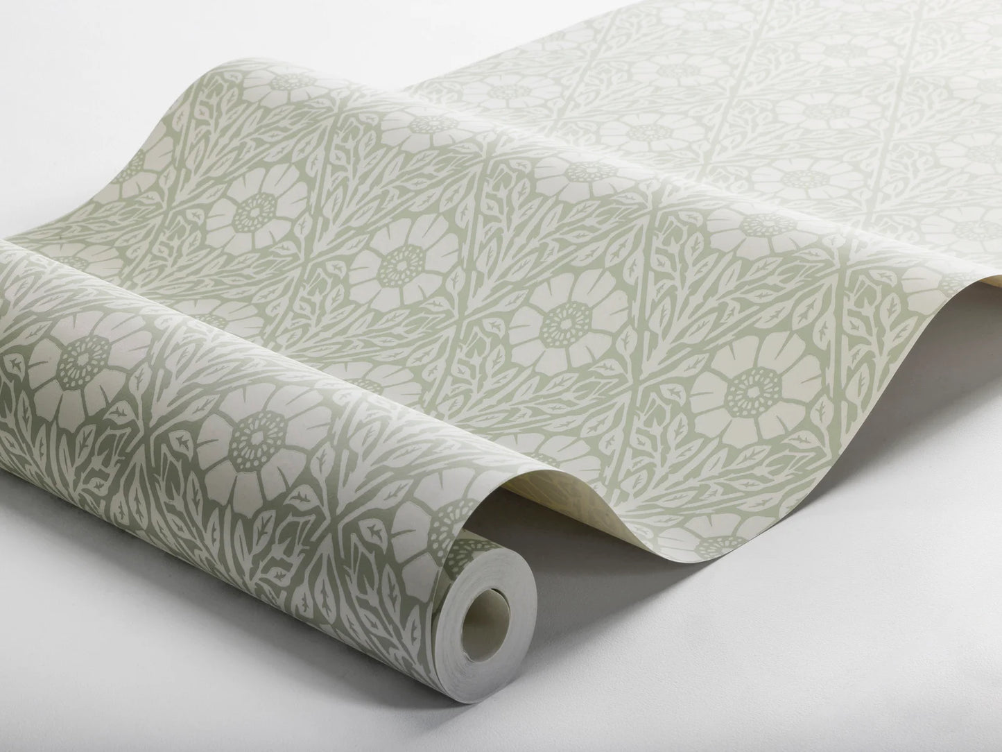 Our Nyponros wallpaper showcases a soft muted green palette with warm white details, to create a harmonious and soothing expression.