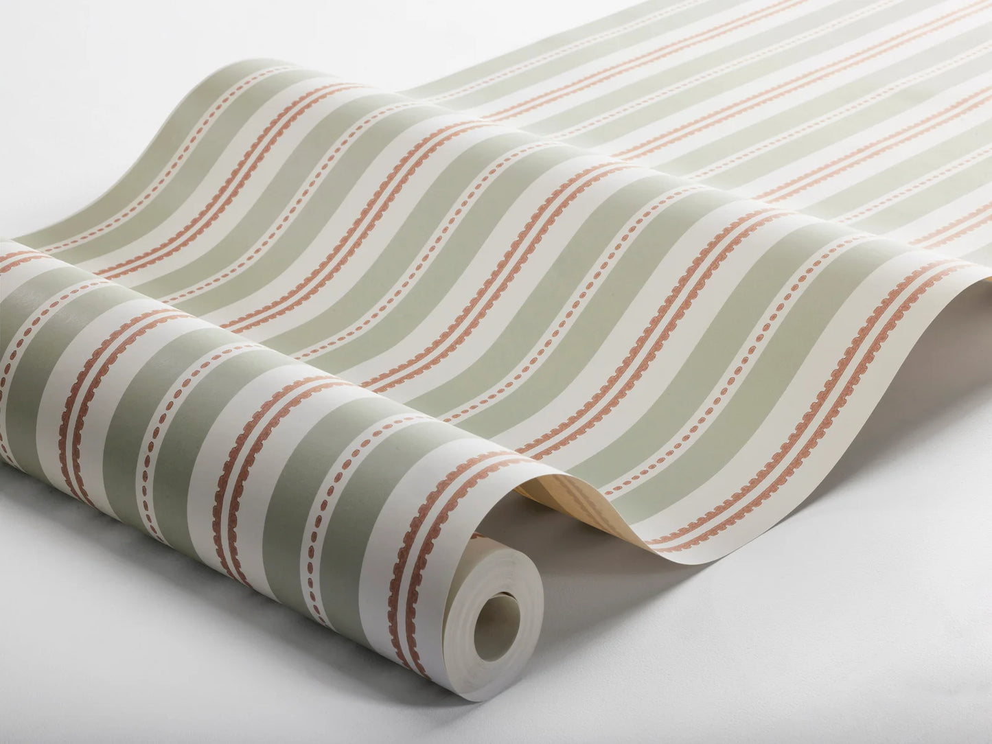 Colored in soft warm green stripes and striking rust-red accents, our Hedda wallpaper is contemporary yet classic in style.