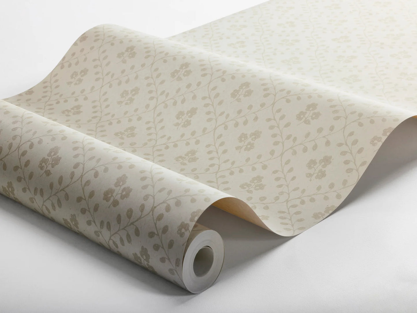 Subtle and sophisticated, our Idun wallpaper features a warm beige background with tone-on-tone beige flowers encased by a decorated yet dainty winding trellis.