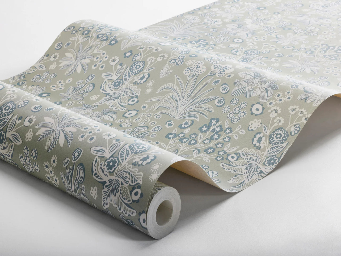 Colored in a soft light green background with delicate white and petrol blue details our Tuva wallpaper is whimsical and fun.