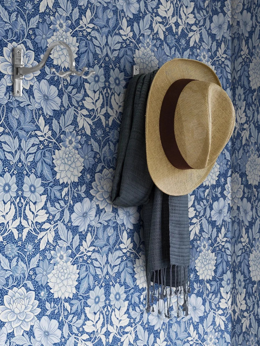Set against a deep blue background, our Dahlia Garden wallpaper features an array of blue shades that seamlessly blend to create a captivating blue wall.