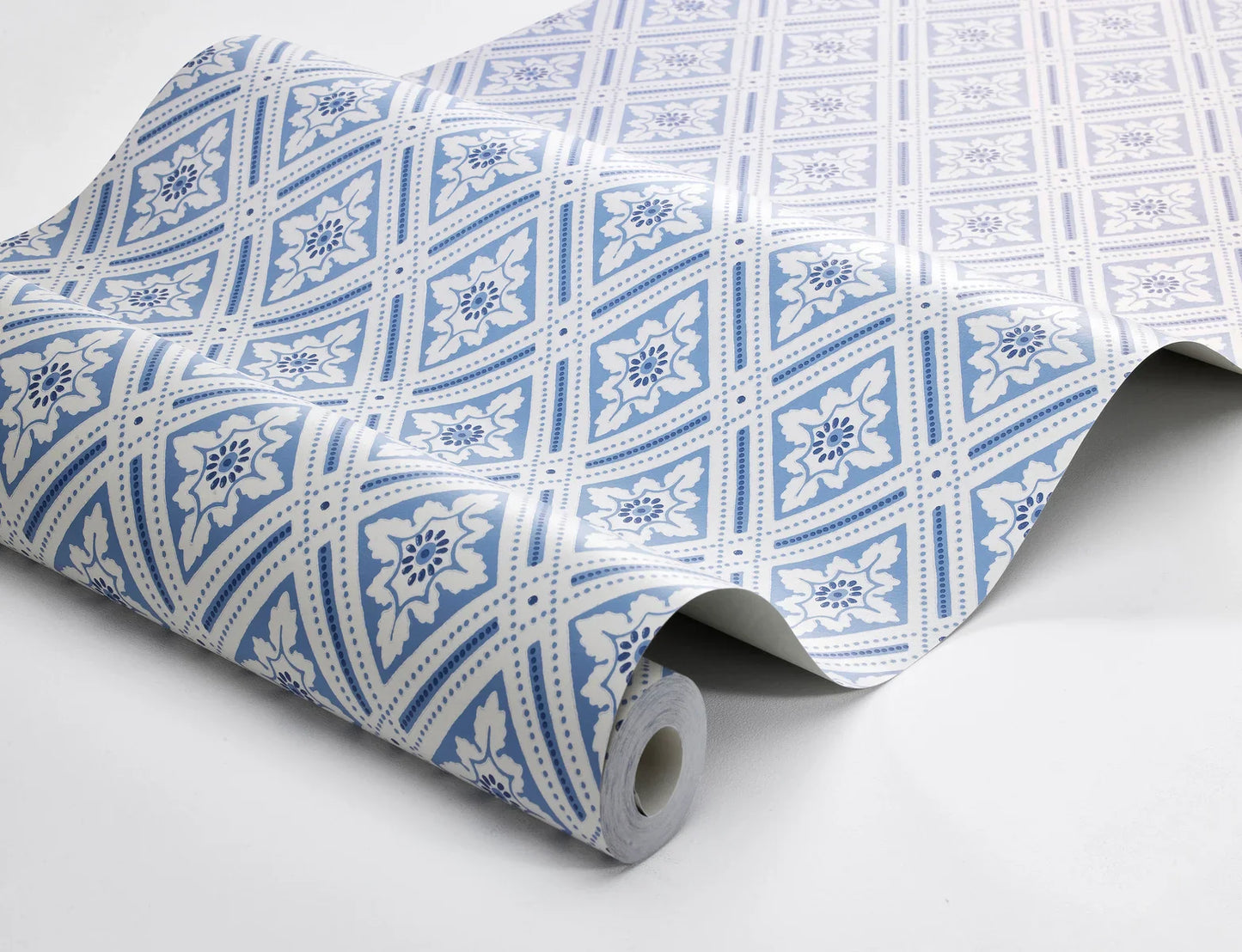 The wallpaper is coloured in a lovely palette of blue shades against a gentle creamy white background.