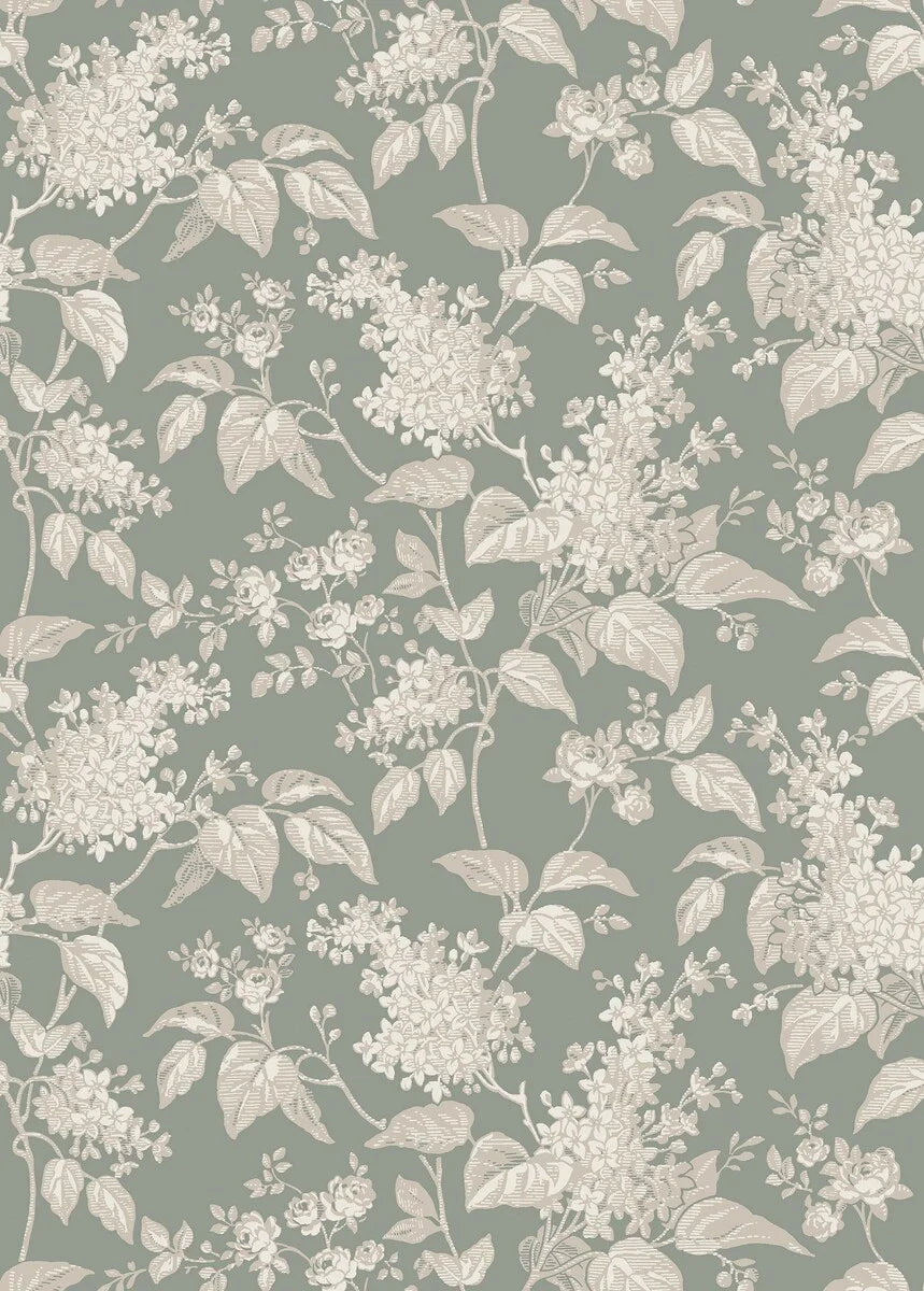 This Syren wallpaper in green features a delicate silhouette pattern of lilac branches and small roses, surface printed in beige and cream on a powdery jade background.