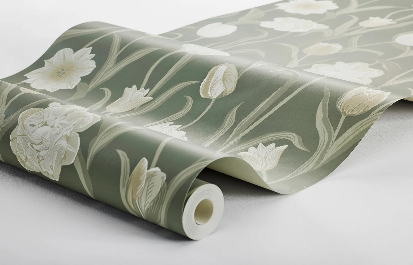 This gorgeous La Belle Epoque wallpaper displays cream-white tulips set against a fairly dark jade green background.