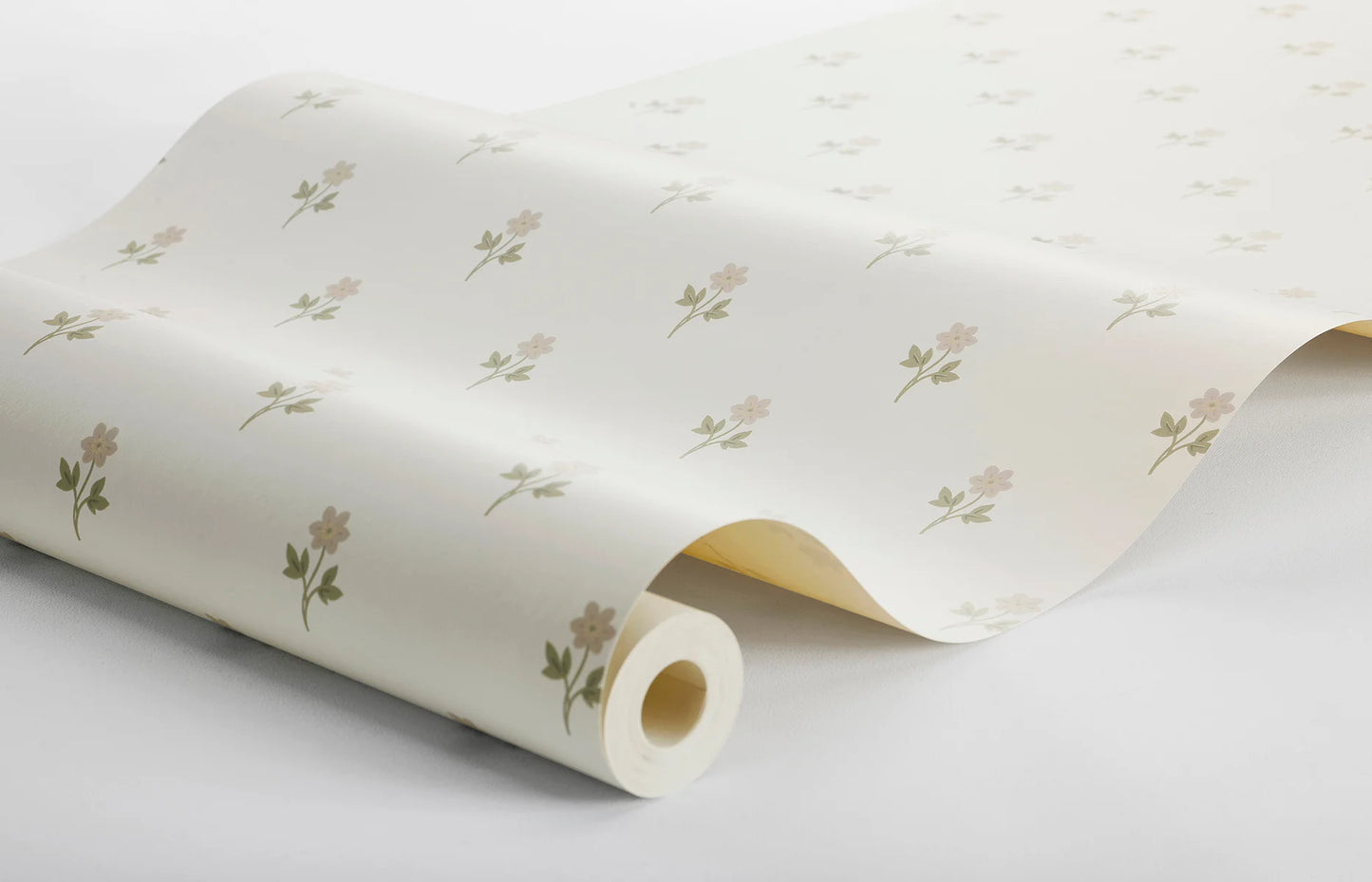 With its dainty pattern of anemone flowers colored in pink with olive green leaves, set against a cream background, this Anemone wallpaper is inspired by classic French textile designs.