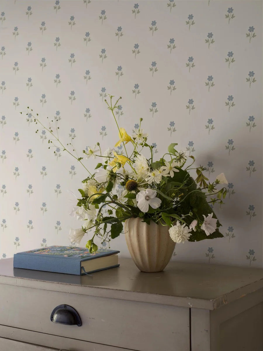 This graceful Anemone wallpaper has blue anemone flowers with green leaves on a white background.
