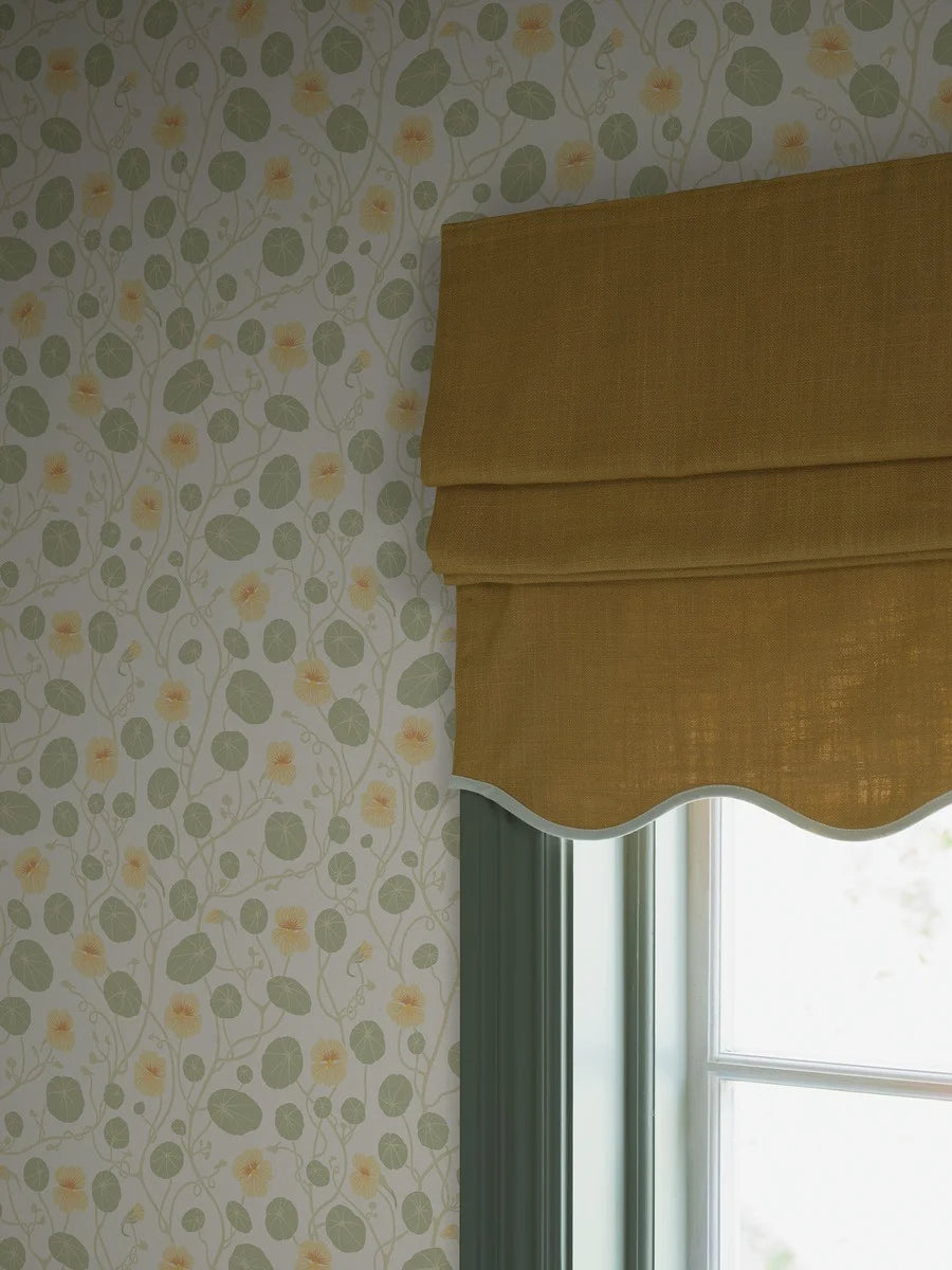 Krasse wallpaper is filled with cheerful Rock Cress flowers in bright yellow tones, with fresh green leaves and winding stems on a white background.