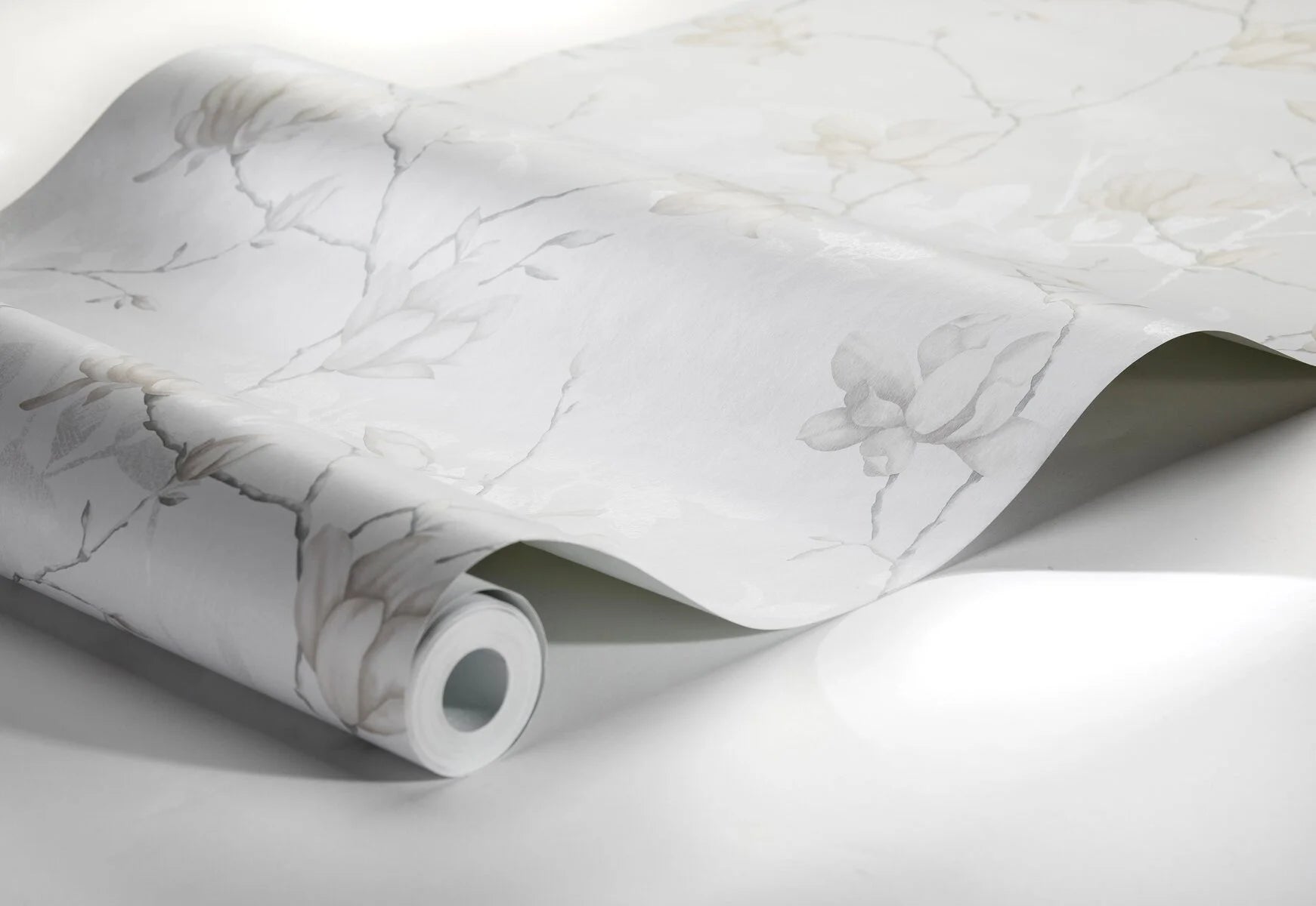 Colored in sophisticated grey tones, our Lily Tree wallpaper celebrates the delicate blooms of the Magnolia tree.