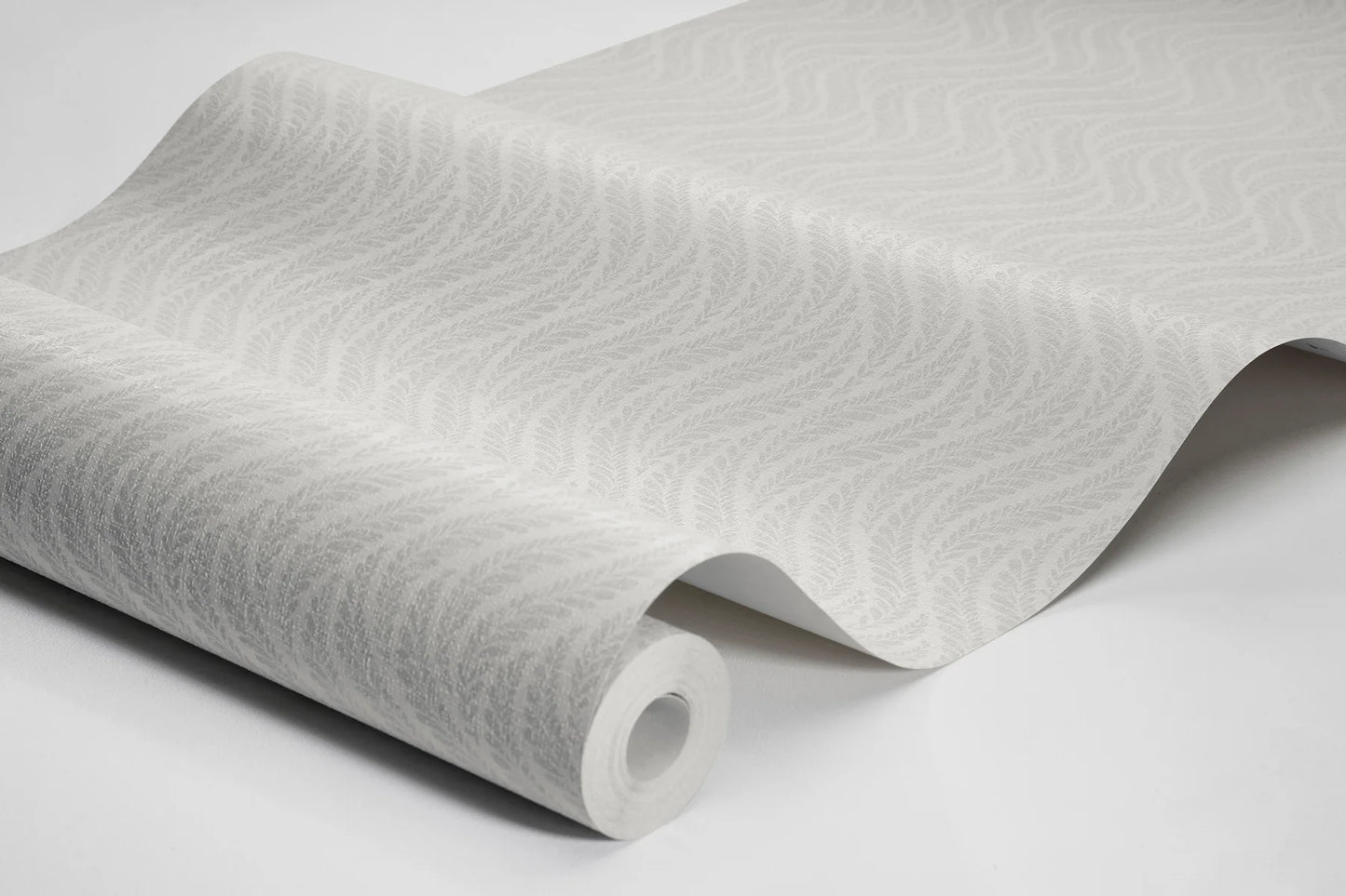 Colored in a soft white palette, our Little Fern wallpaper introduces a modern take on small-scale patterns with an understated elegance.