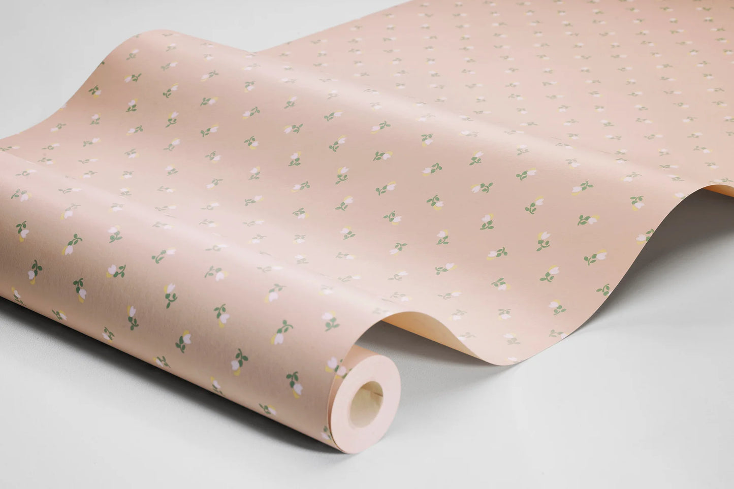 Colored in a pink palette with green and white detailing, our Petite Chérie wallpaper blends timeless expression with playful charm.