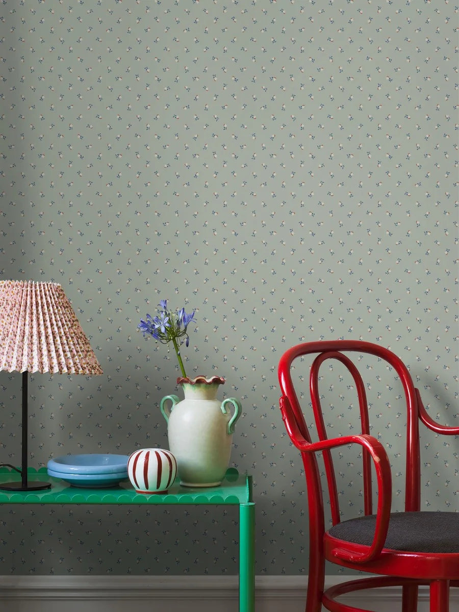 Colored in a fresh green palette with blue, white and red accents, our Petite Chérie wallpaper exudes a vibrant, modern energy.