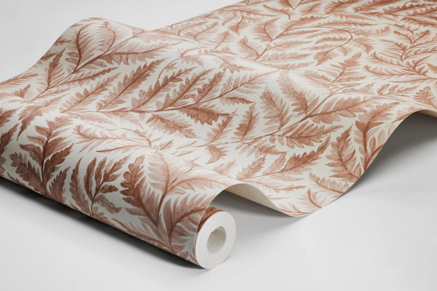 Colored in soft pale red on a cream background, our Ferns wallpaper combines warmth with artistic charm.