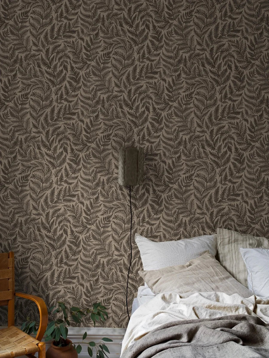 Featuring charcoal black leaves on a cool brown base, our Ferns wallpaper is bold yet understated.