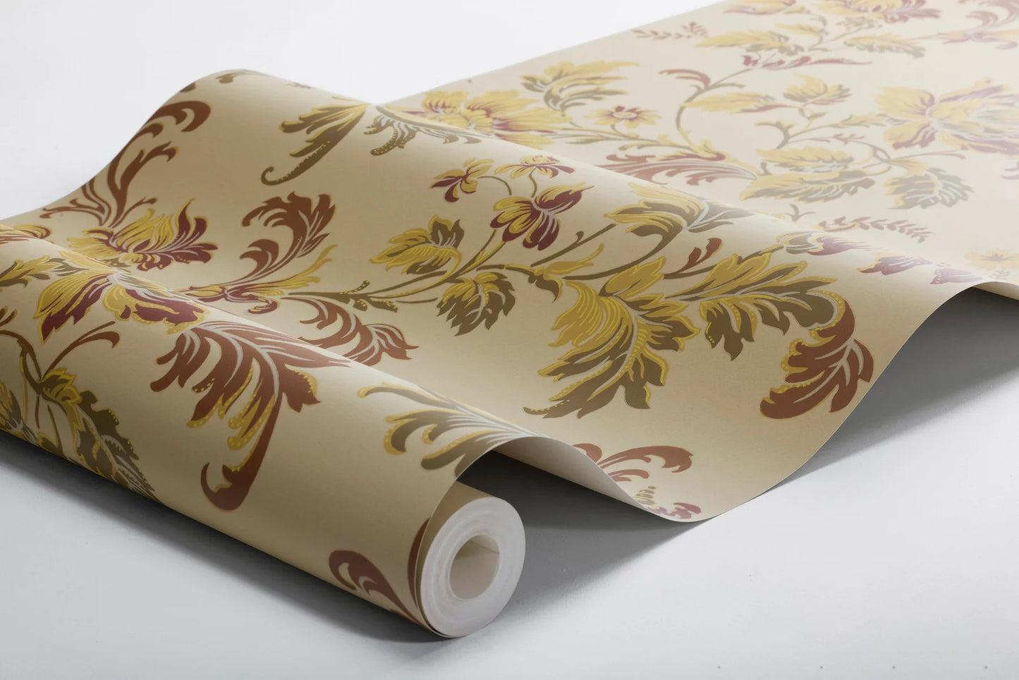 Evocative and autumnal, our Elvira wallpaper is colored in its original 1900s palette – olive, maroon and purple tones on a warm beige background.