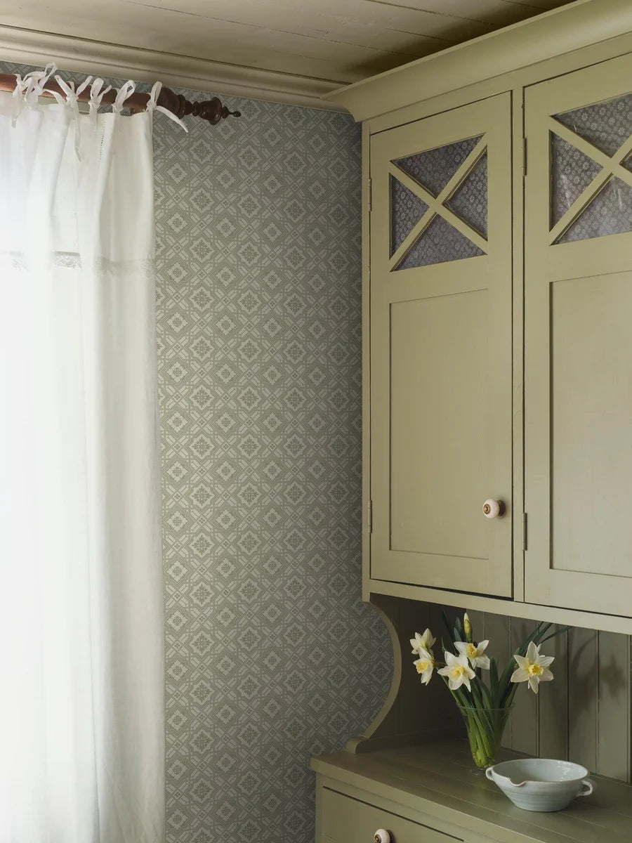Colored in a mild green tone, our Friedrich wallpaper adds soft yet ordered charm to its surrounding space.