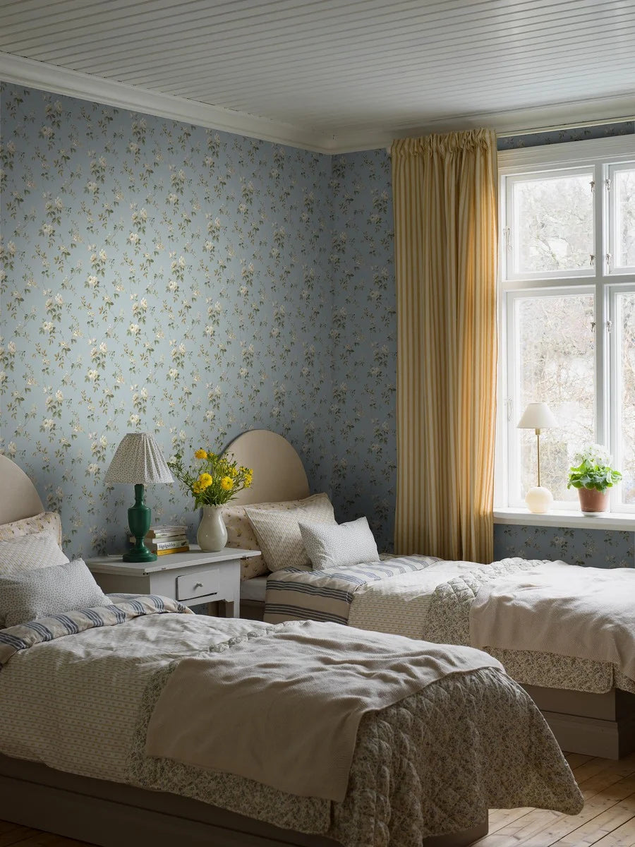 Romantic and breezy, our Värmdö wallpaper is full of early 20th century charm, where floral elegance meets relaxed summer living.