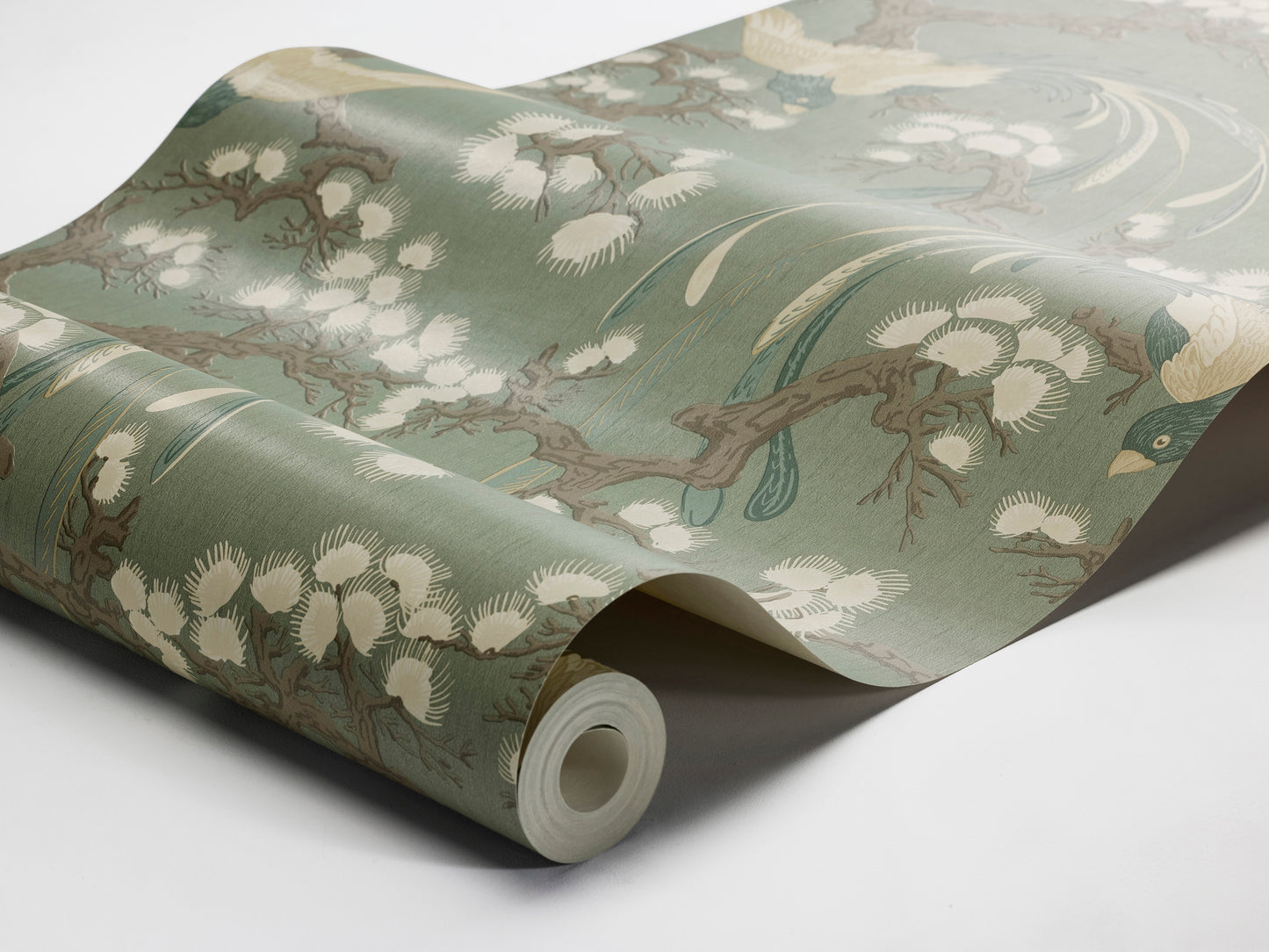 Fenix wallpaper features a deep green backdrop enriched with detailing in blue, brown and cream, creating an elegant and decorative presence on the wall.