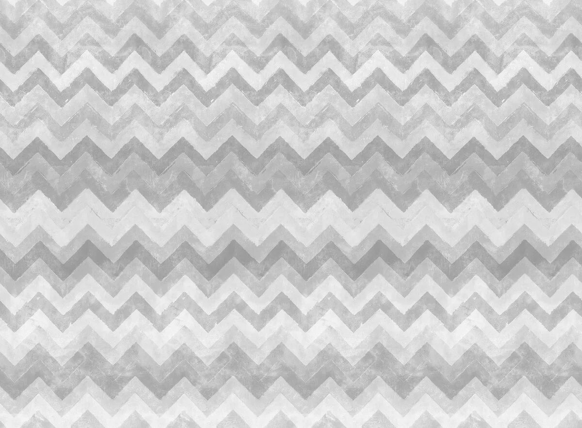 Within its zigzags, chevrons and cool grey color palette, this wallpaper harmonizes Nordic and African influences