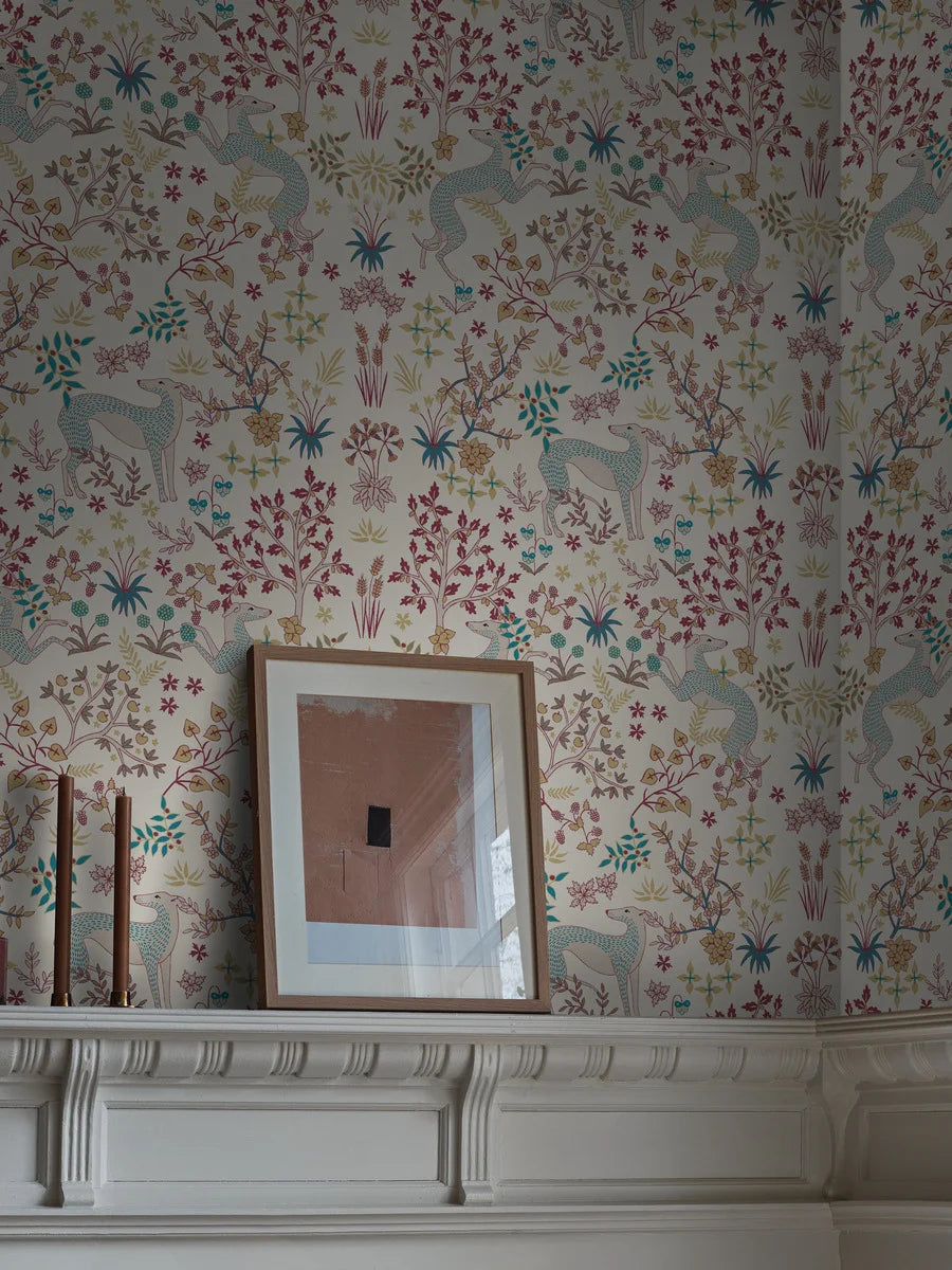 The light wallpaper Whippet is adorned with a playful, dense pattern of delicate vegetation and beautiful whippet dogs.