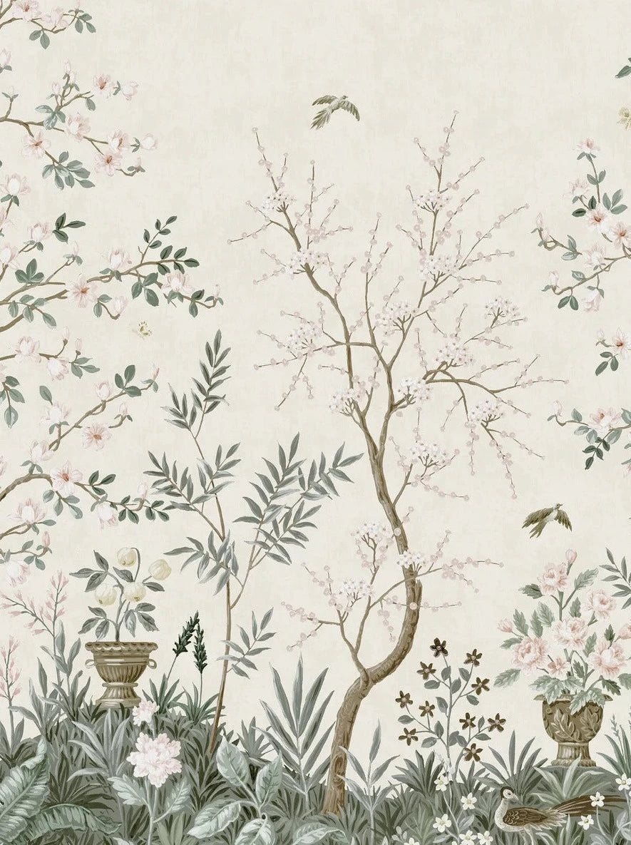 The wallpaper Magnolia Garden is adorned with a hand-painted pattern full of beautiful details; blooming magnolia but also flower urns, fruit trees, birds, and butterflies.