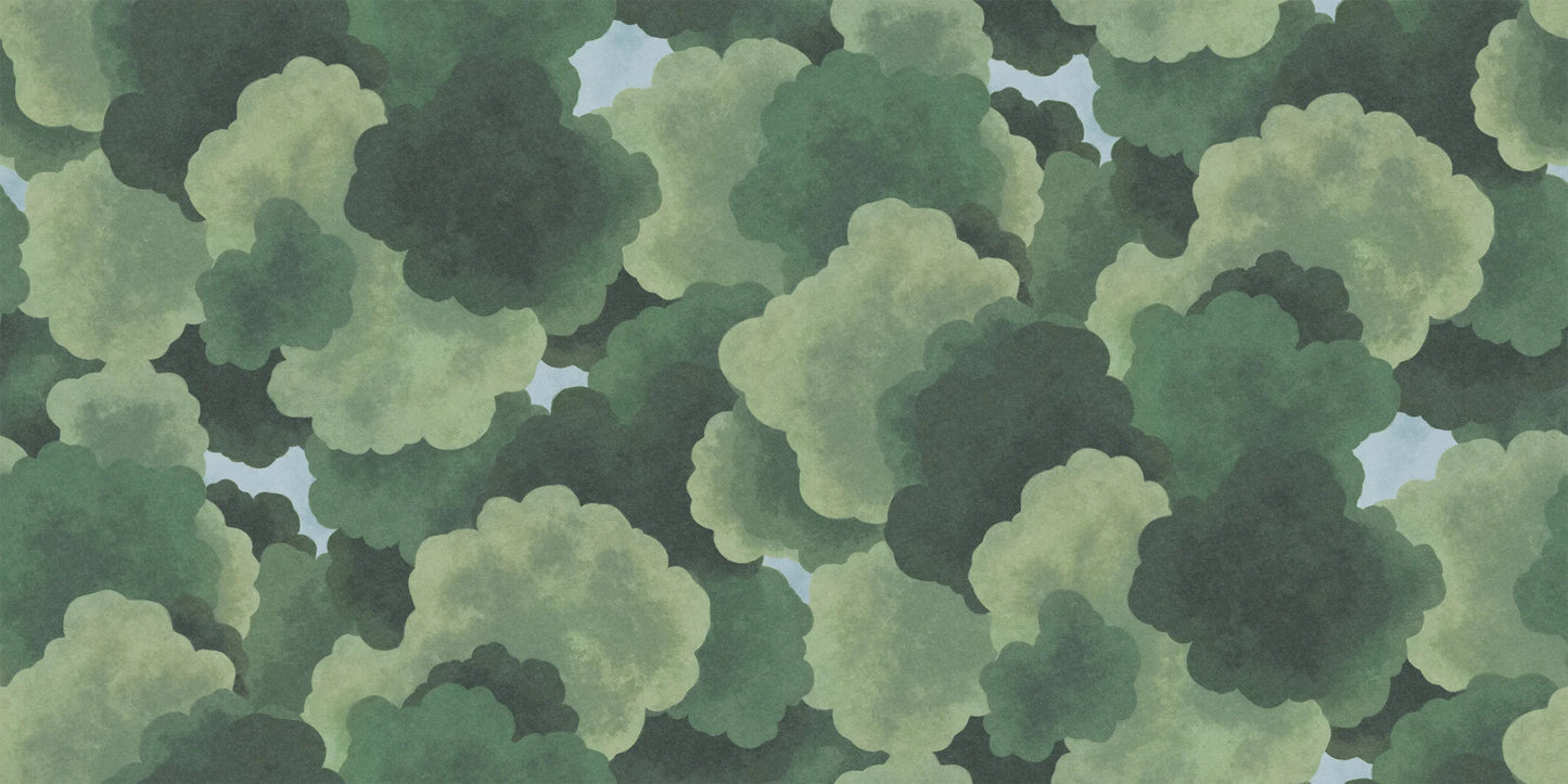 The children's wallpaper Under the Trees offers a new perspective – as if you're lying on your back, dreaming in the shade of rustling, green treetops with glimpses of clear blue sky.