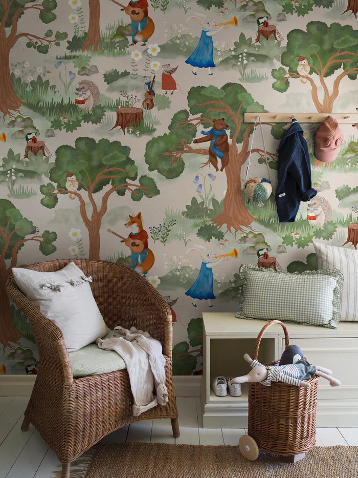 On the charming mural wallpaper Woodland Orchestra, the forest animals have gathered in the clearing between the trees to play music together. Can you see who the conductor is?