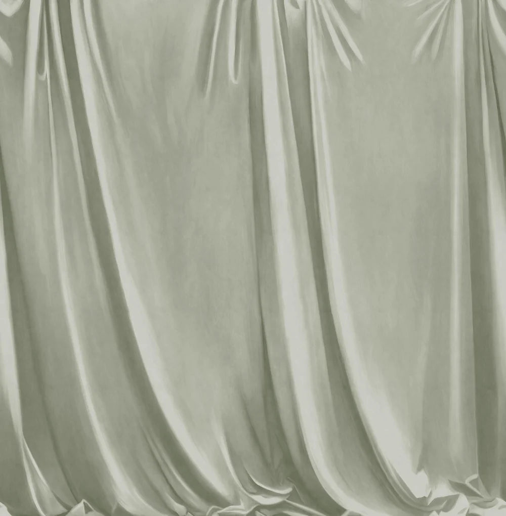 Drape is a hand-painted trompe-l'œil wallpaper mural where soft drapery creates a textile-like, cosy feel on the wall.