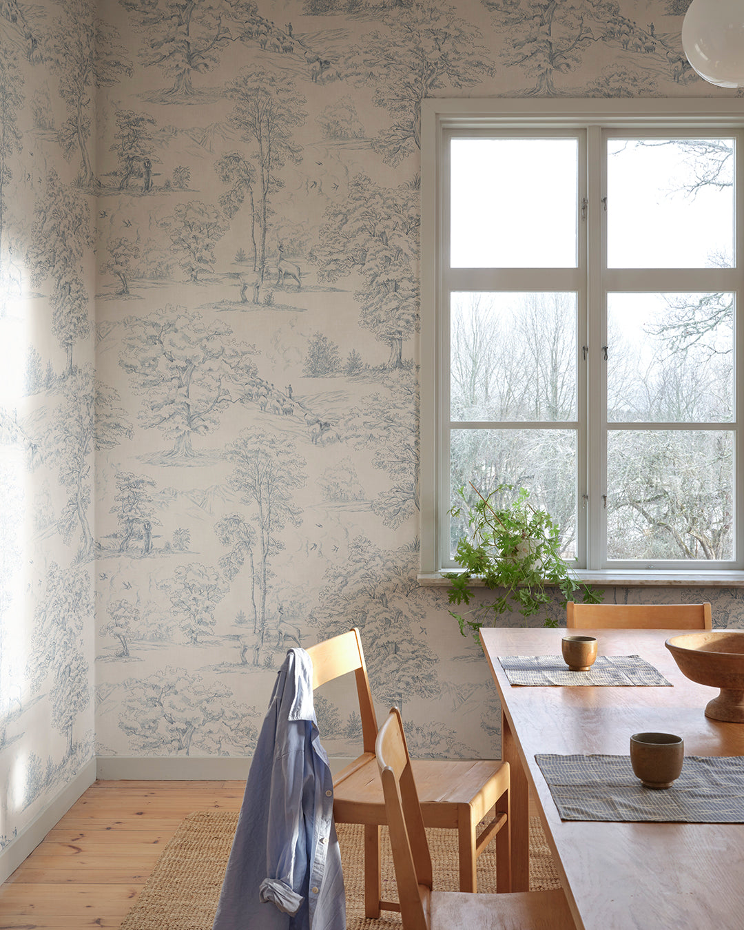 This toile wallpaper is Sandberg's own travelogue from Southern France with a hand-drawn illustration on a becoming textile background.