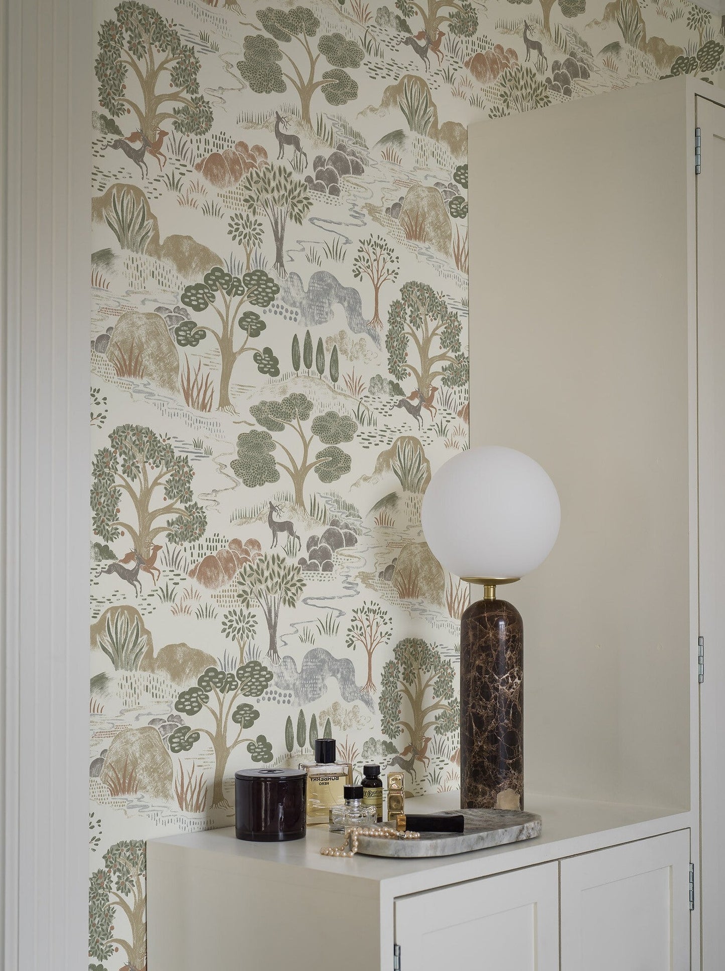 Indulge in the naturalistic allure of our Diana wallpaper in muted tones of olive green, terracotta and warm gray and beige tones.