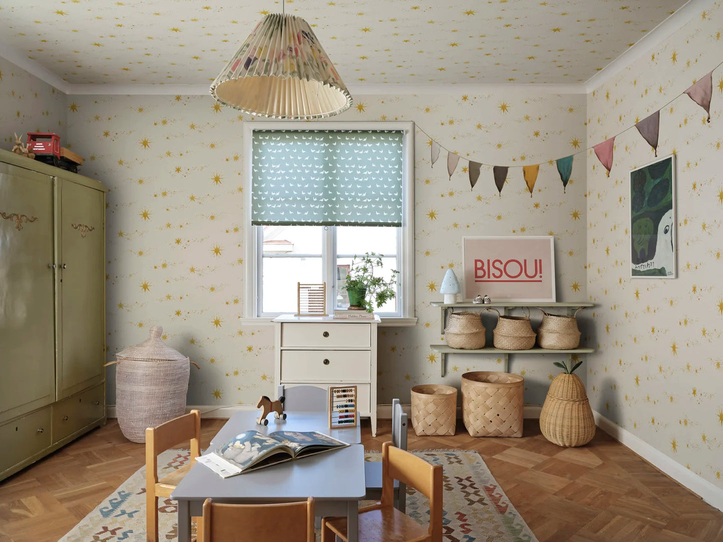 The beautiful hand-painted stars dance over the wallpaper like stars in the sky, created together with Johanna Bradford