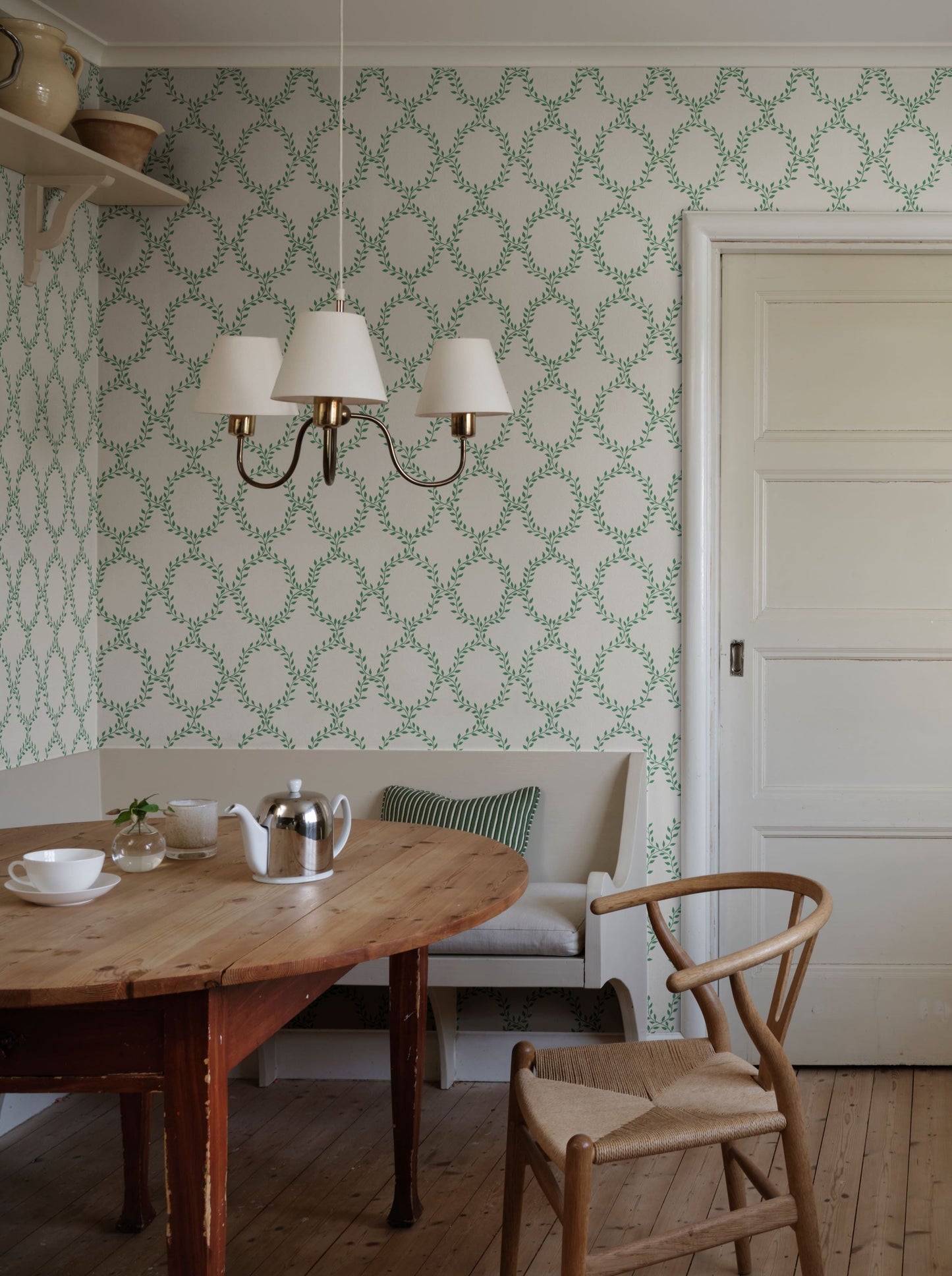 Our beloved wallpaper design Wilma brings to mind wreaths but in colors with an international feel.
