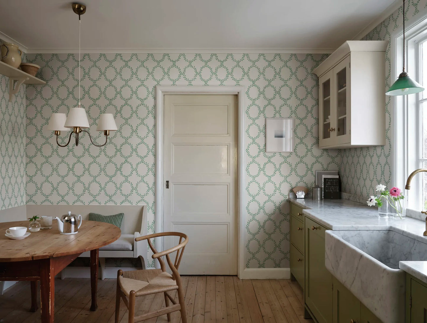 Our beloved wallpaper design Wilma brings to mind wreaths but in colors with an international feel.