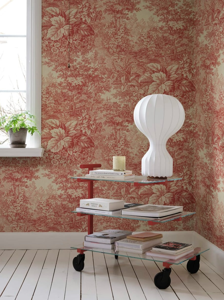 Based on a textile print from 19th century France featuring lush forest clearings that lay the wallpaper like an embracing blanket over the walls.