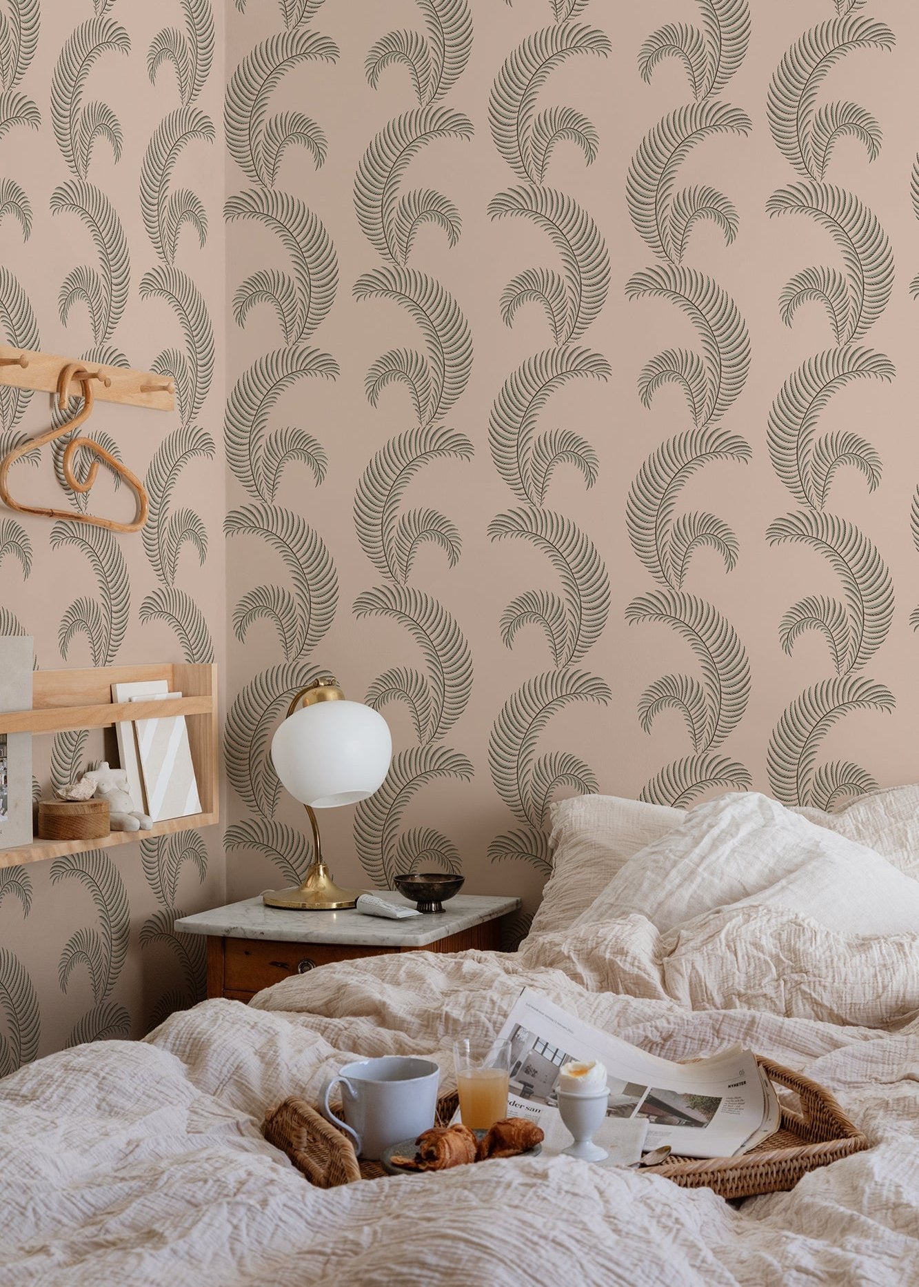 Sophisticated wallpaper with a stylized edge, these graphic palm leaves lend a sleek and luxurious atmosphere to the room.
