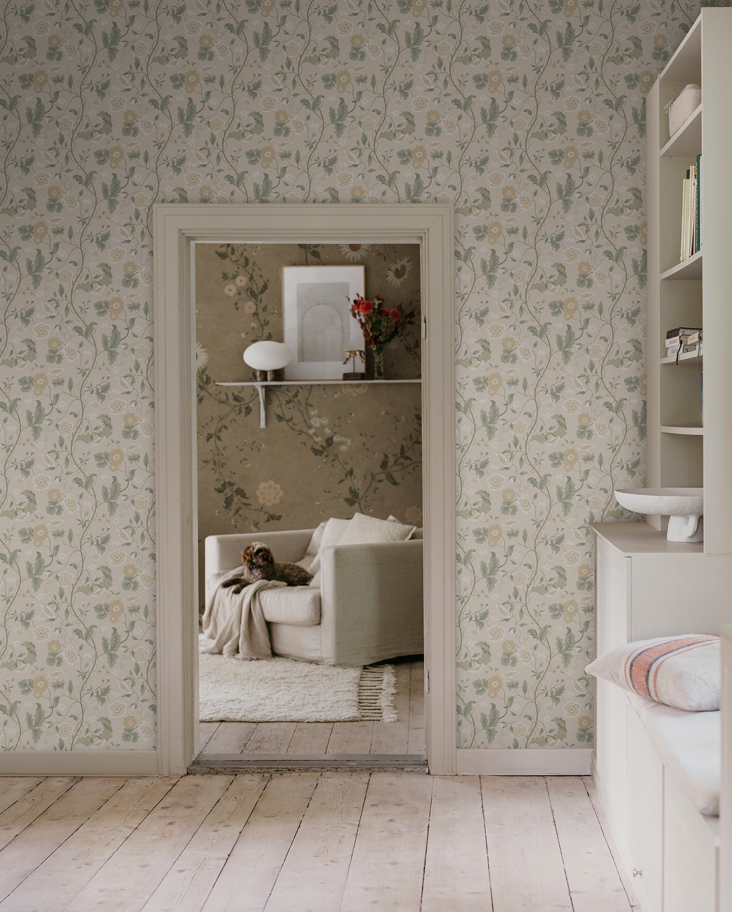 Japanese anemones, cup-and-saucer vines, and avens intertwined offer a softly verdant Arts & Crafts-inspired wallpaper with intricate details and an enveloping character.