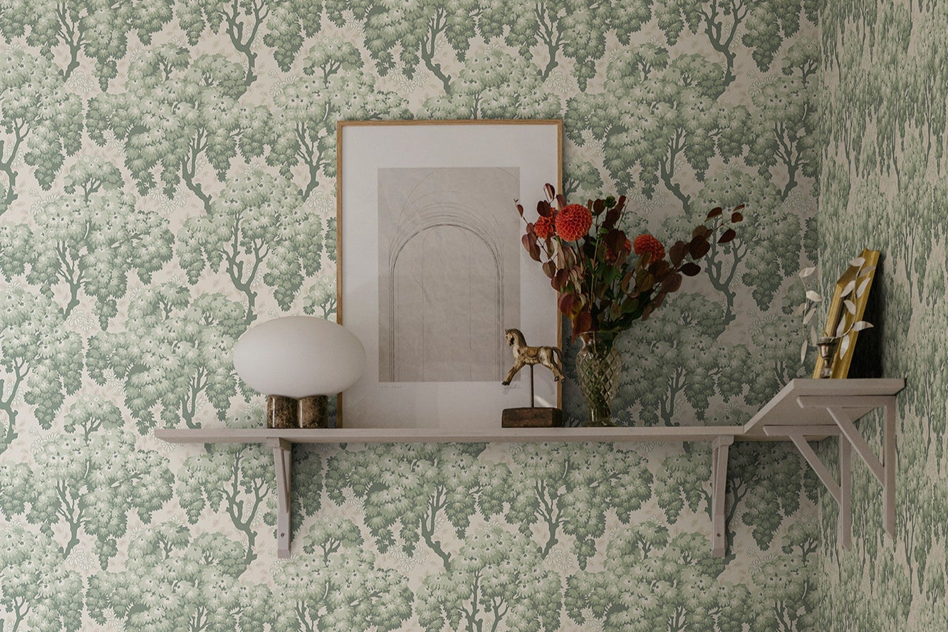 Lush tree canopies against a meadow of daisies create a harmonious, large-patterned wallpaper curtain on the wall.
