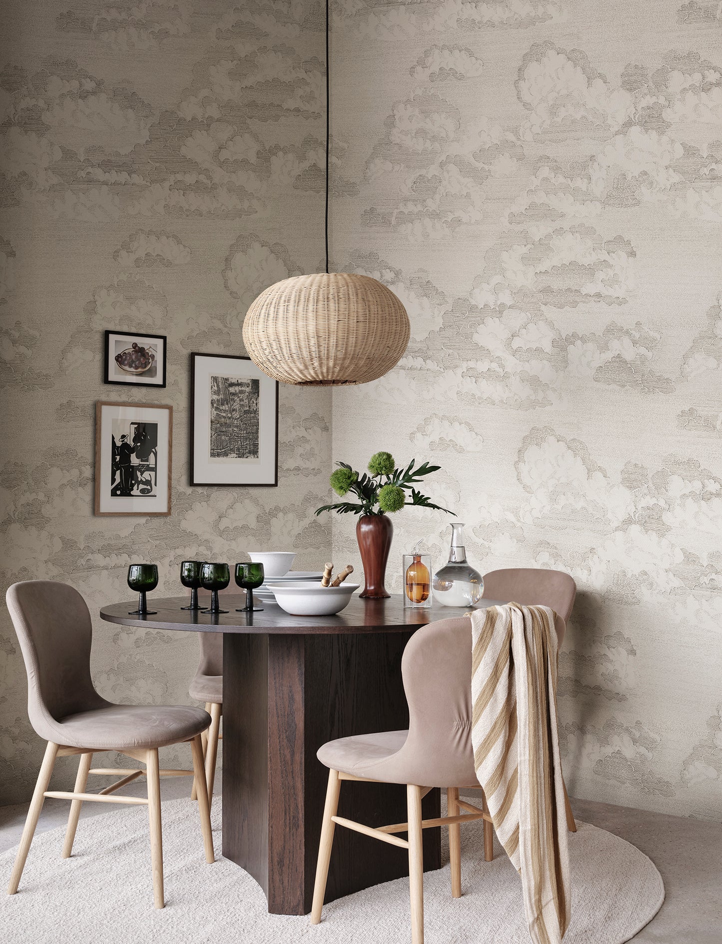 Experience the quiet elegance of the Bonnie wallpaper in graphite. This design captures a dreamy sky view with scattered clouds that evoke classic etchings