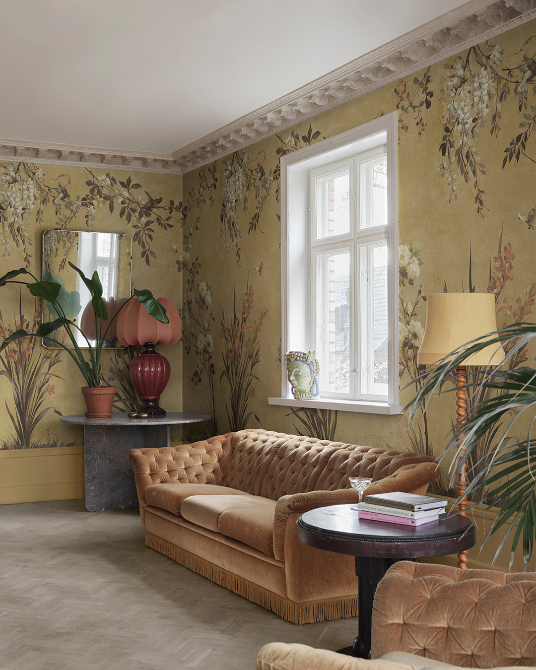 Dive into an antique European garden with the Nicola wallpaper—featuring hand-painted birds and graceful flowers on a patina backdrop.
