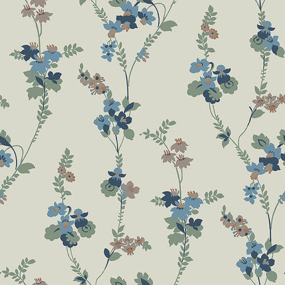 Colored in a palette of misty blue, brown and cool green-blue on a linen background, our Vera wallpaper in collagraph print features a 1920’s vintage pattern from our archives.