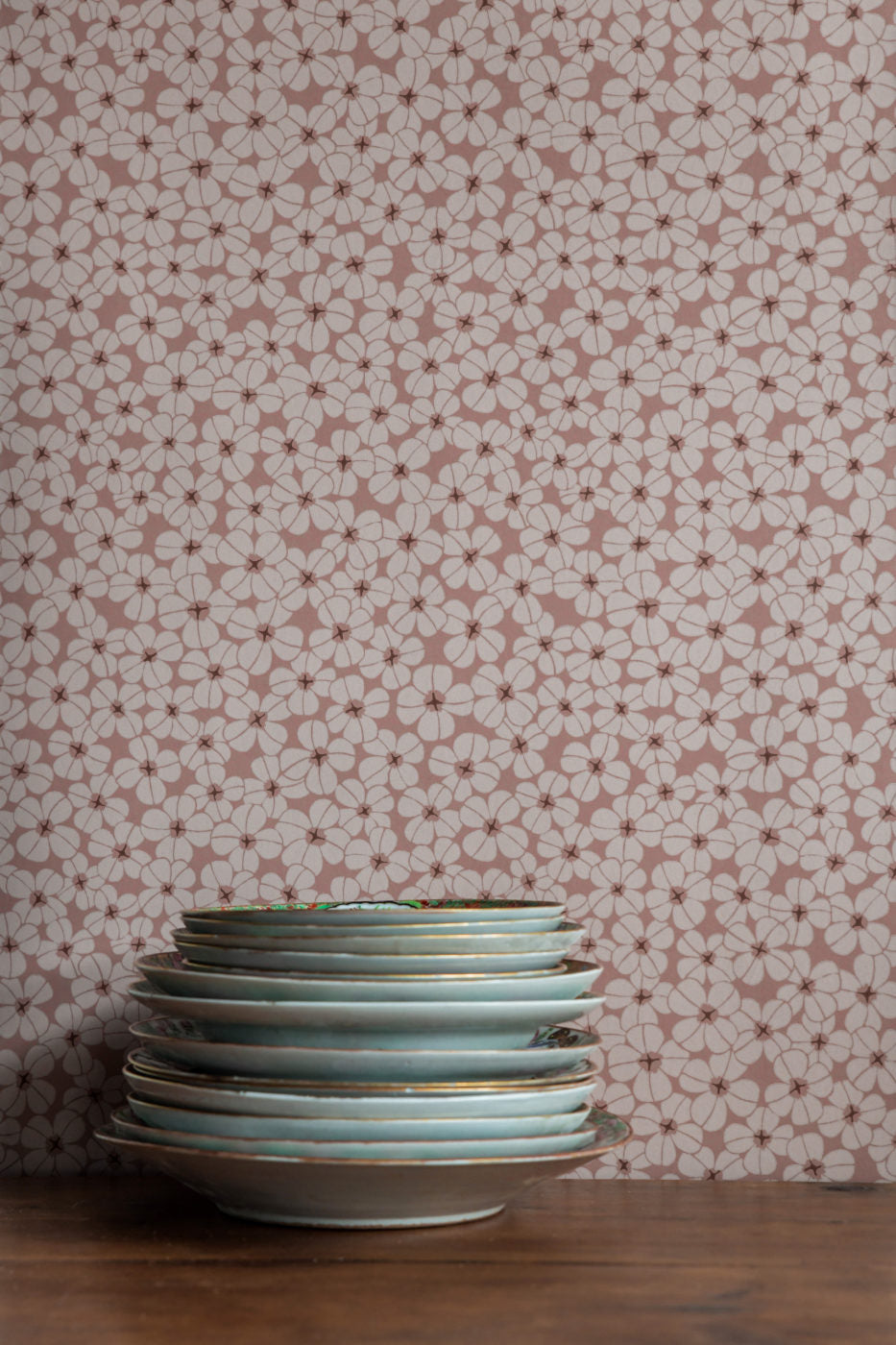 The oxalis forms a shower of flowers in this wallpaper design.