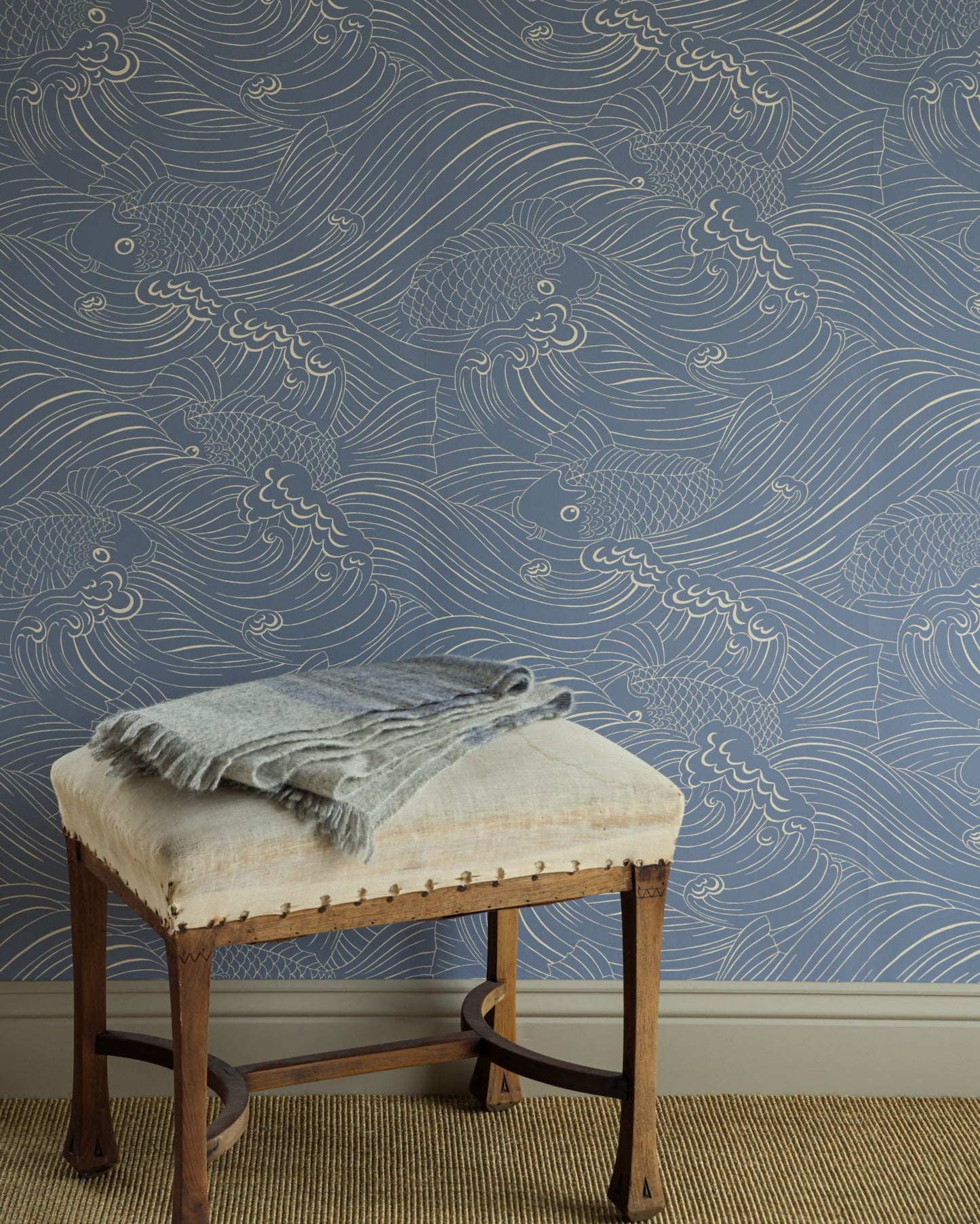 Wallpaper with inspiration from old woodcut techniques, Emma von Brömssen’s seemingly simple design Plenty more fish unveils an intriguing play with lines where fish hide in a wavy sea.